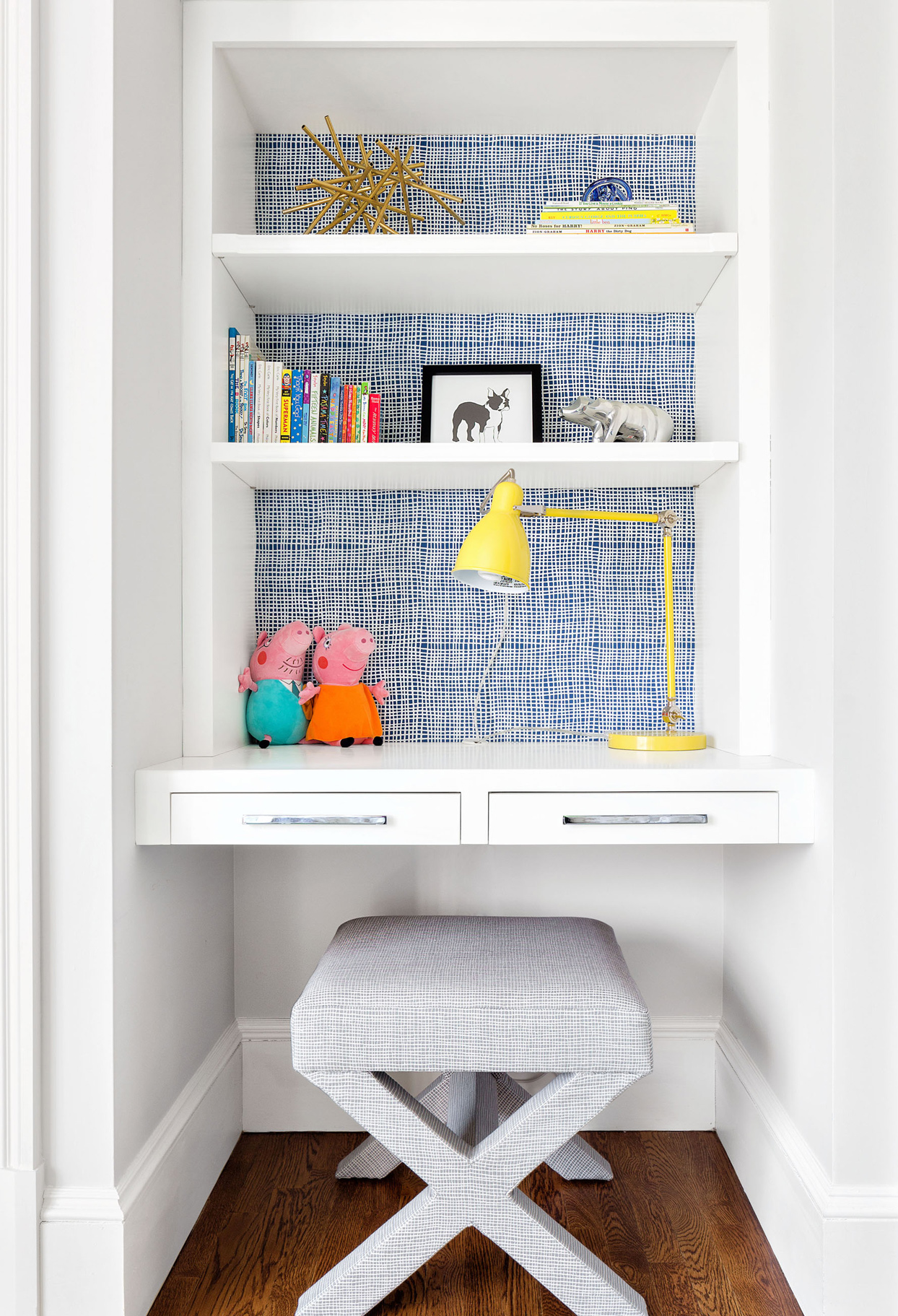 blue and white alcove utilized as childrens study corner